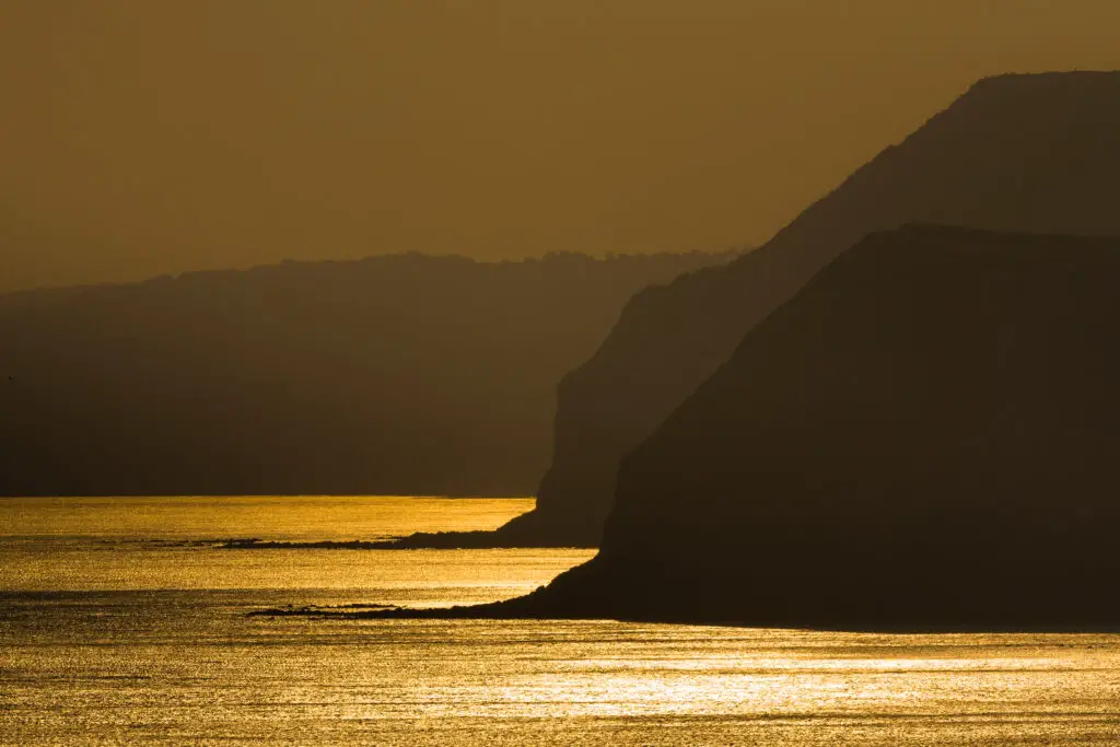 35 - Evening sun reflecting on the sea, West Bay, Dorset, England